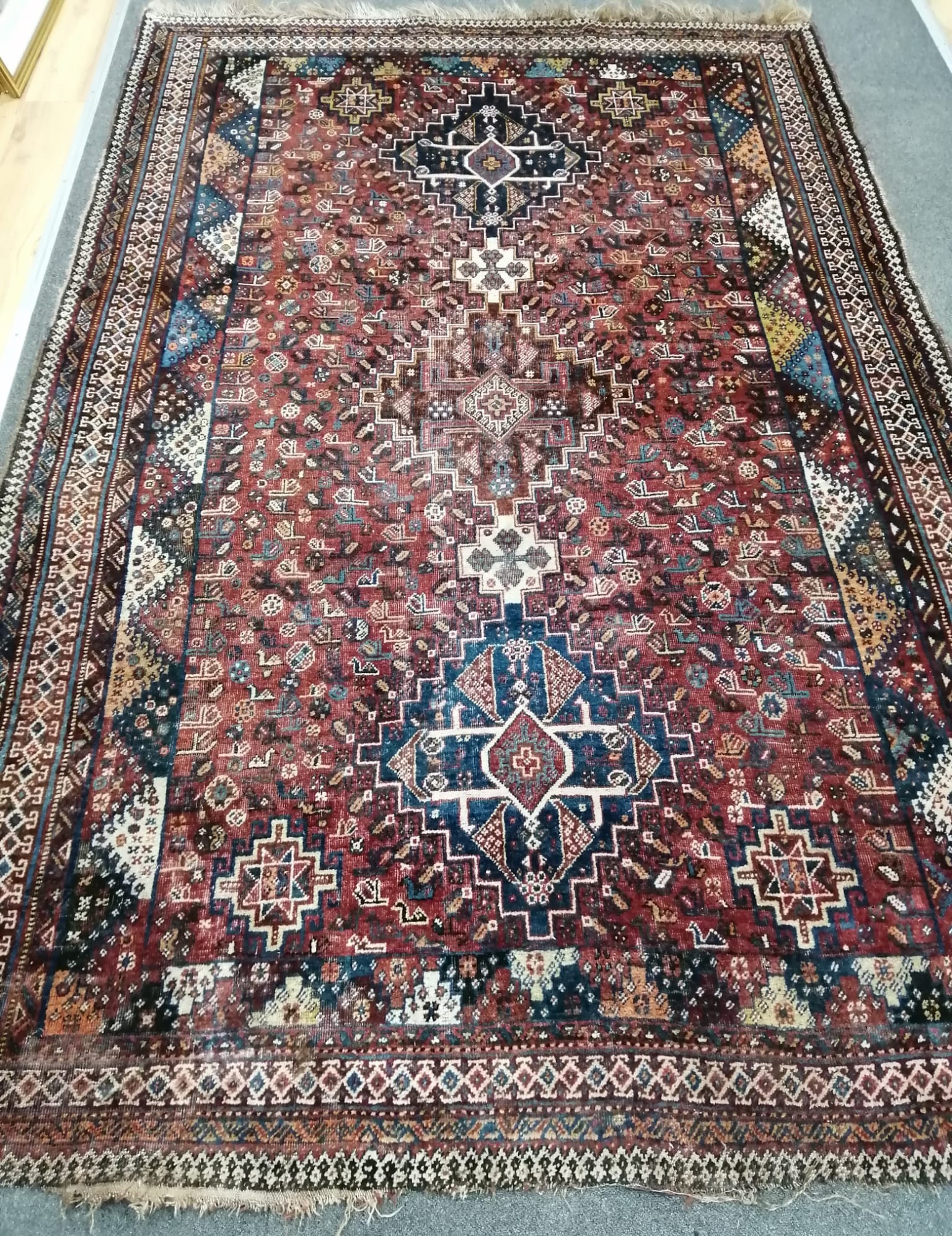 A North West Persian red ground rug, a Tabriz blue ground rug and two smaller modern rugs, largest 254 x 172cm